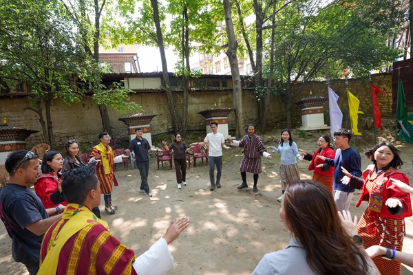 Corporate group experiencing Bhutanese cultural activities