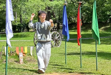 Participating in Khuru (Traditional Darts)
